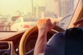 Hand of man driving car travel on road Traffic jam and sunlight Royalty Free Stock Photo