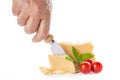 Hand of a man getting a piece of parmigiano cheese