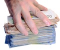 hand of man while grabbing a lot of money in paper banknotes Royalty Free Stock Photo