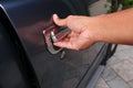 Hand man on handle. Close-up of man in opening a car door. Royalty Free Stock Photo