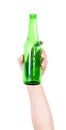 Hand of a man hiding a green bottle of beer isolated on the empty white background Royalty Free Stock Photo