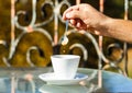 Hand of man hold coffee spoon, or coffe cup. Cappuccino and black espresso coffe cup. Coffee drink. Close up of a man Royalty Free Stock Photo