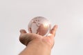 Hand man holding glass earth on isolated background. Concept of caring for the environment and the fragile weakness of the world Royalty Free Stock Photo