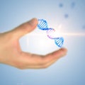 Man hand holding dna helix over blue Royalty Free Stock Photo