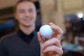 Hand man holding golf ball Royalty Free Stock Photo