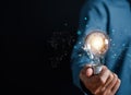 Hand man holding illuminated lightbulb, idea, innovation and inspiration with glowing virtual brain, smart intelligent creativity Royalty Free Stock Photo