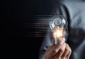 Hand man holding illuminated lightbulb, idea, innovation and inspiration with glowing virtual brain, smart intelligent creativity Royalty Free Stock Photo