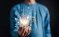 Hand man holding illuminated lightbulb, idea, innovation and inspiration with glowing virtual brain, smart intelligent creativity Royalty Free Stock Photo