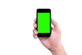 Hand of man holding mobile smart phone with chroma key green screen on white background Royalty Free Stock Photo