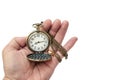 Hand of a man holding a pocket watch for a look. On a white back Royalty Free Stock Photo