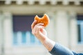 Hand of a man holding / showing a bitten sandwich Royalty Free Stock Photo