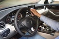The hand of man holds on to the helm of car. Interior of car by close up