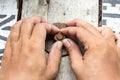 Hand man install rusty nut and bolt on wood Royalty Free Stock Photo