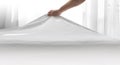 the hand of a man making the bed with a white cotton blanket Royalty Free Stock Photo
