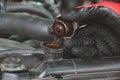 Hand a man opening the Radiator cap of engine for check level of water Car radiator