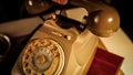 The hand of a man picks up the receiver of a vintage telephone and puts it back Royalty Free Stock Photo