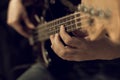 Hand of a man playing bass guitar Royalty Free Stock Photo