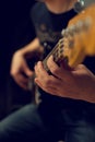 Hand of a man playing bass guitar Royalty Free Stock Photo