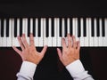 Hand man playing piano. Classical music instrument. Top view Royalty Free Stock Photo