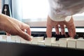 Hand man playing piano. Low angel view. Classical music instrument