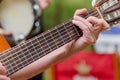 hand of a man playing a Spanish guitar, music concept Royalty Free Stock Photo