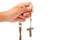 Hand of a man praying with Rosary, isolated on