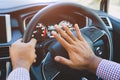 Hand man pushing car horn while driving car