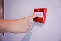 Hand pulling fire alarm switch Royalty Free Stock Photo