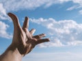 Hand of a man reaching to sky. Royalty Free Stock Photo