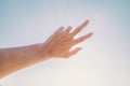 Hand of man reaching to towards sky. Hand make symbol Royalty Free Stock Photo