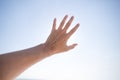 Hand of a man reaching to towards sky. Hand make symbol. Royalty Free Stock Photo