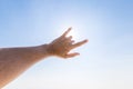 Hand of a man reaching to towards sky. Hand make symbol. Royalty Free Stock Photo