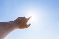 Hand of a man reaching to towards sky. Hand make symbol. Royalty Free Stock Photo