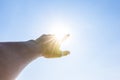 Hand of a man reaching to towards sky. Hand make symbol. Royalty Free Stock Photo