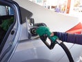 Hand Man refilling the car with fuel at the refuel station Royalty Free Stock Photo