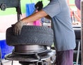 Hand of man removing car tire Royalty Free Stock Photo