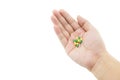 A hand of a man with some capsule pills on white background Royalty Free Stock Photo