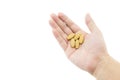 hand of a man with some pills on white background Royalty Free Stock Photo