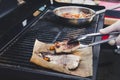 professional chef cooking fish on a barbeque Royalty Free Stock Photo