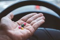 Hand of Man takes drugs in the car Royalty Free Stock Photo