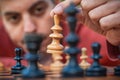 Man in chess game moves a piece, hand close up Royalty Free Stock Photo