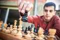 Man in chess game moves a piece, hand close up Royalty Free Stock Photo