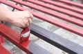 Hand of a man worker holding a paintbrush painted steel for industrial.