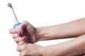 Hand with manicure holds single blue electric toothbrush Royalty Free Stock Photo