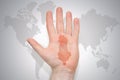 Hand with map of albania on the gray world map background Royalty Free Stock Photo