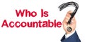 Hand with marker writing: Who Is Accountable