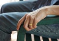 The hand of married women sitting on a chair