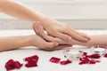 Hand massage at spa salon on white towel Royalty Free Stock Photo