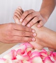 Hand Massaging Foot In Spa Royalty Free Stock Photo