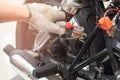 hand of Mechanic Check and Add Brake fluid to motorcycle , selective focus . auto mechanic uses to check and Maintenance Royalty Free Stock Photo